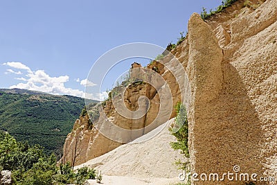 Lame Rosse in the Sibillini`s mountains. Stratifications of rock in the shape of pinnacles and towers consisting of gravel held Stock Photo