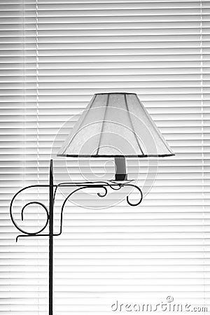 Lamp Against Blinds in black and white Stock Photo