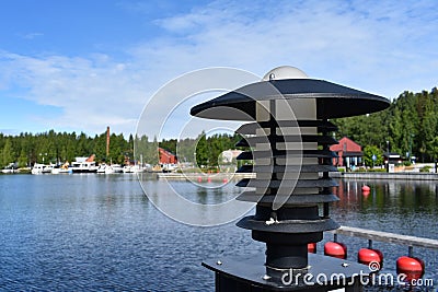 Lamp by the boats` dock in a small town Stock Photo