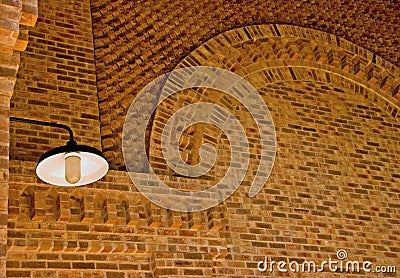 A lamp in a brick building Stock Photo