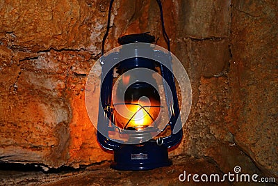 Lamp on a cave wall Stock Photo