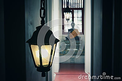 The lamp or lamp inside the chapel gives yellow light to the back, Stock Photo