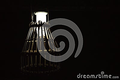 A lamp with lampshades of bamboo cage Stock Photo
