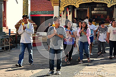 Lamphun, Thailand: Thais Making Merit Editorial Stock Photo