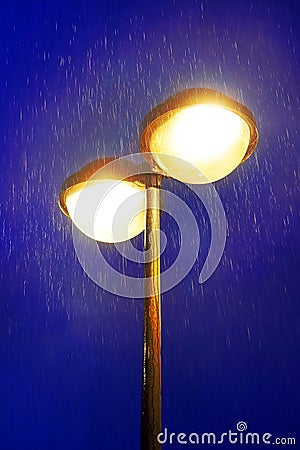 Lampost at night with rain Stock Photo