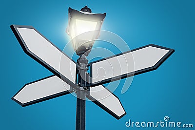 Lamppost with directional arrows Stock Photo