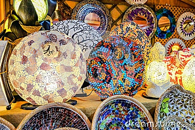 Lamps, candles, dishes and crafts in the street stalls of the medieval fair Editorial Stock Photo