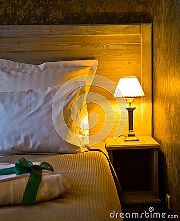 Lampshade by bed Stock Photo