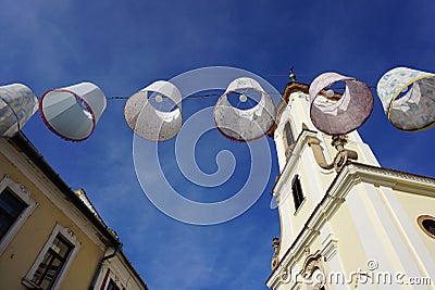 Lampshades in the air. Decorative exterior canvas lampshades. lanterns or lampions above public street above town street Stock Photo