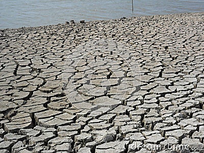 Land erosion after drainage of a reservoir. Stock Photo