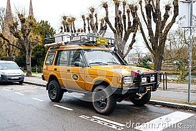 Land Rover Defender Camel Trophy with luggage on the roof Editorial Stock Photo