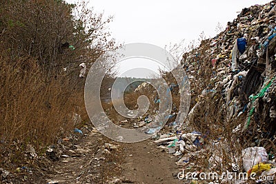 Landfill in Ukraine, piles of plastic dumped in . The roads along inorganic waste jumble Stock Photo