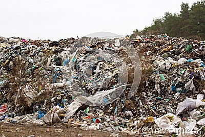 Landfill in Ukraine, piles of plastic dumped in . The roads along inorganic waste jumble Editorial Stock Photo