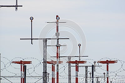 Landing light Directional sign markings on the tarmac of runway at a commercial airport Stock Photo