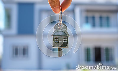 Landlord unlocks the house key for new home Stock Photo