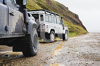 LANDMANNALAUGAR, ICELAND - AUGUST 2018: two offroad cars on the mud terrain Editorial Stock Photo