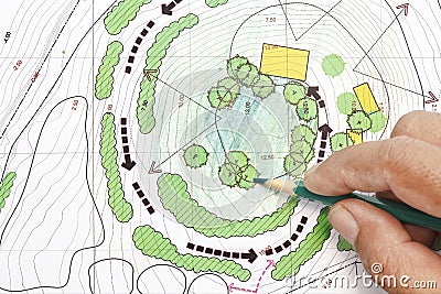 Landscape Architect Designing on plans Stock Photo