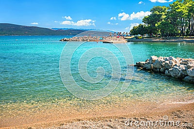 Turquoise small bay and beach in Krk, main town at Krk island, Croatia Stock Photo