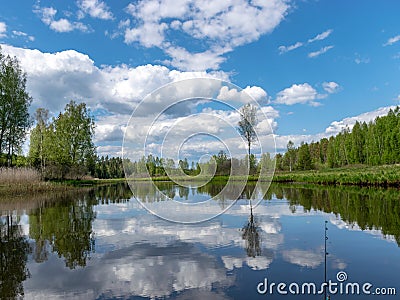 Landscape with a beautiful river in spring, cloud reflections in the water Stock Photo