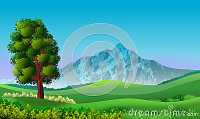 Landscape with blue sky, mountains, green hills and a tree Stock Photo