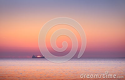 Boat in the sea at sunset Stock Photo