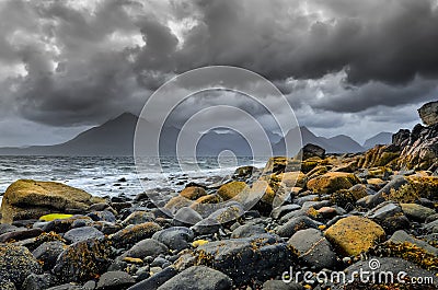 Landscape coastline view of rocks and Cullin hills, Scotland Stock Photo