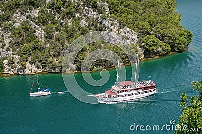 Landscape of a cruise ship on the river surrounded by greenery in Skradin, Croatia Editorial Stock Photo