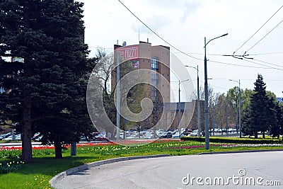 Landscape design of nature green, grass, dense bushes, large Christmas trees, firs and flowers. Editorial Stock Photo