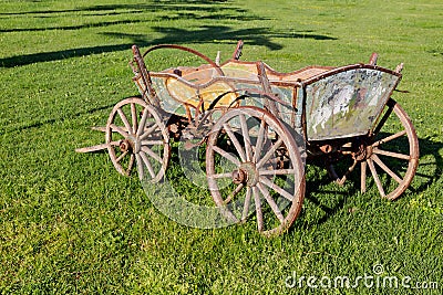 Old cart on the lawn Stock Photo