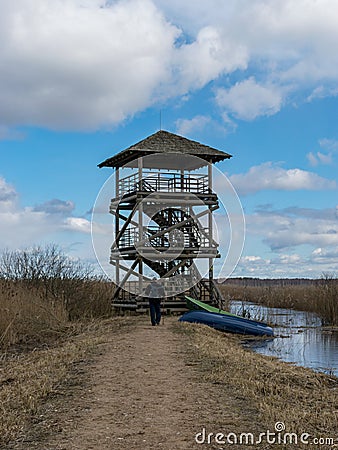 Landscape with dirt road and bird watching tower Editorial Stock Photo