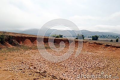 Landscape with dry cracked soil in Xieng Khouang Province, Laos Stock Photo