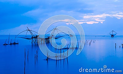 Landscape, Fish trap in the lake in the morning and blue sky background Stock Photo