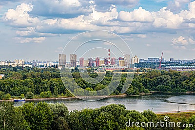 Landscape with forests, river and silhouettes of houses in the background Stock Photo