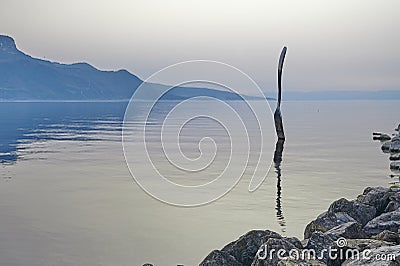 A landscape of the Fork, a stainless steel fork in front of the Alimentarium museum on the shore of Lake Geneva Lac Leman. Editorial Stock Photo