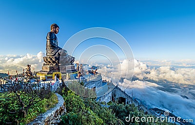 Landscape with Giant Buddha statue on the top of mount Fansipan Stock Photo