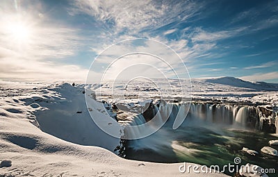 Landscape, Godafoss water fall at winter in Iceland with bright sunlight Stock Photo