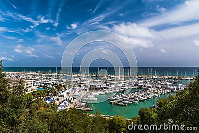 Landscape with green trees and sailing and pleasure boats harbour on background Editorial Stock Photo