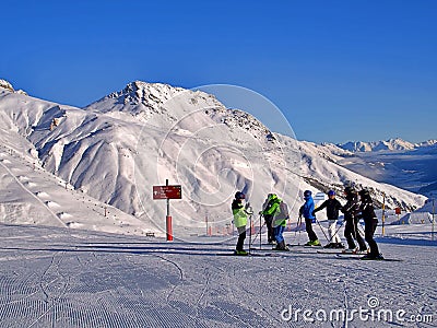 Landscape of a group of skiers gathered on a snowy mountain in St Moritz, Switzerland Editorial Stock Photo