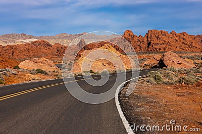 Landscape of a highway road through a desert at sunrise at Valley of Fire Stock Photo