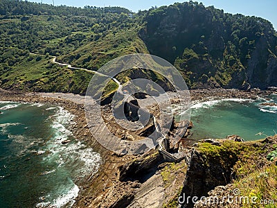 Landscape of the historic San Juan Gaztelugatxe fort surrounded by the sea in Spain Stock Photo