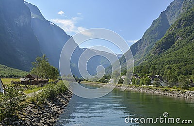 Landscape with houses, river and mountain norwegian fjords at viking village Gudvangen, Norway Stock Photo