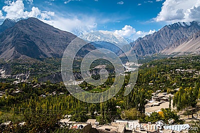 Landscape of Hunza valley and Nagar in October, separated by the river and surrounded by mountains. Stock Photo