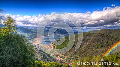 Landscape of Mavrovo national park with rainbow, mountain and lake, FYR Macedonia Stock Photo