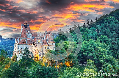 Landscape with medieval Bran castle known for the myth of Dracula at sunset Stock Photo