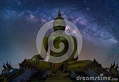 Landscape with Milky way galaxy. Night sky with stars and silhouette Biggest Buddha statue at temple in Thailand Stock Photo