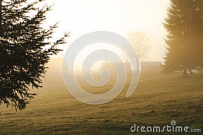 landscape in the mountains mist sunrise village Stock Photo