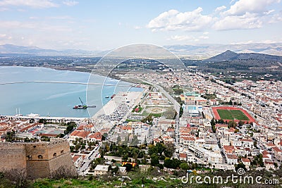 Landscape of Nafplio city with harbour, stadium and the ancient stone walls of the Fortress of Palamidi in Naflplio, Greece Stock Photo