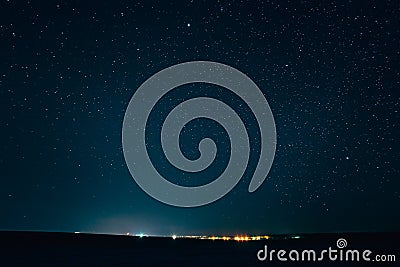 Landscape With Natural Night Sky Stars Background. Starry Sky Over Town Stock Photo