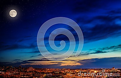Landscape of the night city, moon and stars in the sky Stock Photo