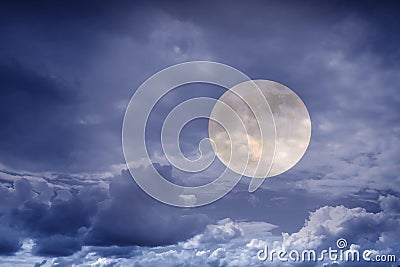 The mystical full Moon in the clouds Stock Photo